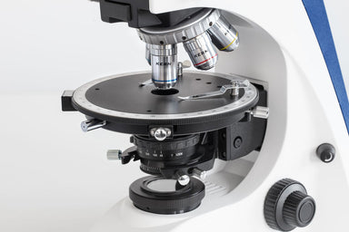 rotating stage with objectives above and Abbe condenser below.