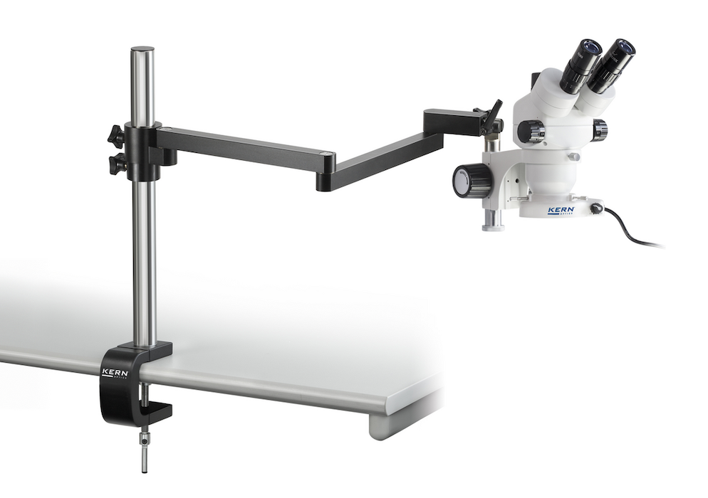 Stereo microscope with boom stand mounted to a table.