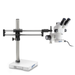 Stereo microscope mounted on a double-arm boom stand with base plate.