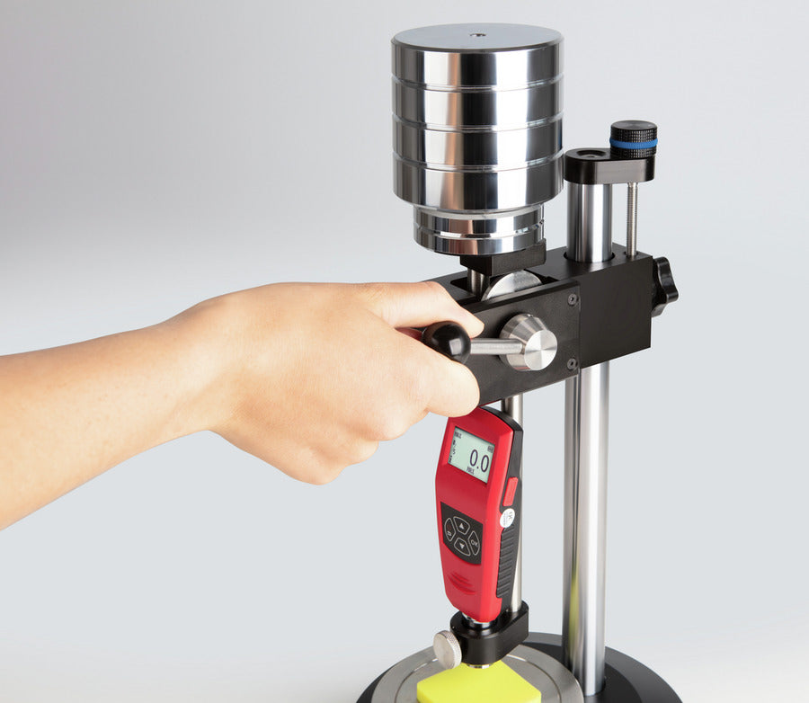 Hand using a Hardness tester 